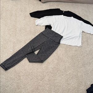 Lot of 3 Lululemon items, 2 speckled tops and a high waisted pair of leggings.